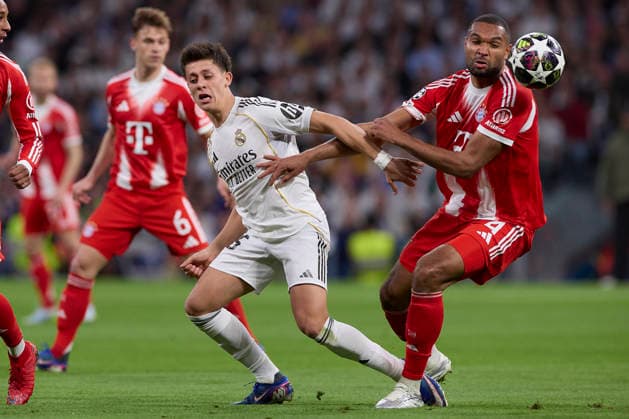 April 7, 2026, Madrid, Spain: Arda Guler (L) of Real Madrid CF and Jonathan Tah (R) of FC Bayern Munchen are seen in action during the UEFA Champions League 2025 2026 quarter-finals first leg football match between Real Madrid CF and FC Bayern Munchen at Santiago Bernabeu stadium. Final score Real Madrid CF 1:2 FC Bayern Munchen Real Madrid CF Vs FC Bayern Munchen In Madrid - 07 Apr 2026  - ZUMAs197 20260407_aaa_s197_201 Copyright: xFedericoxTitonex