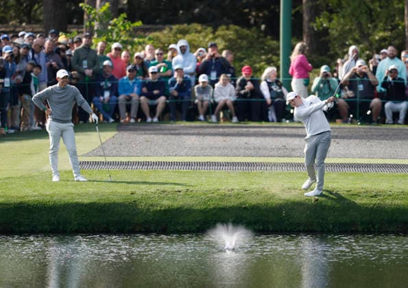 Rory McIlroy of Northern Ireland and Matt Fitzpatrick of England skip balls off of the water in front of the 16th green during a practice round on the Wednesday before The Masters Tournament at Augusta National Golf Club on Wednesday, April 8, 2026 in Augusta, Georgia.  AUG202604081012 JOHNxANGELILLO