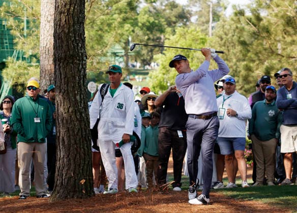Justin Thomas hits out of the pine straw to the 7th green during a practice round on the Wednesday before The Masters Tournament at Augusta National Golf Club on Wednesday, April 8, 2026 in Augusta, Georgia.  AUG20260408110 JOHNxANGELILLO
