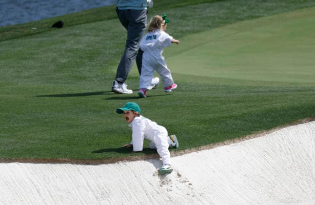 Jordon Spieth s son Sammy climbs out of a sand trap as he and his daughter Sophie take part in the 2026 Masters golf tournament Par 3 Contest at Augusta National Golf Club in Augusta, Georgia, on Wednesday, April 8, 2026. The 2026 Masters Golf tournament begins on Thursday, April 9.  AUG20260408828 JOHNxANGELILLO