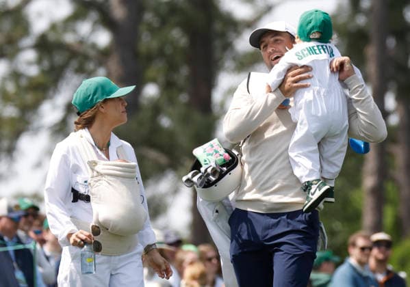 Scottie Scheffler, his wife Meredith Scheffler and their sons Bennett and Remy walk down a fairway as they take part in the 2026 Masters golf tournament Par 3 Contest at Augusta National Golf Club in Augusta, Georgia, on Wednesday, April 8, 2026. The 2026 Masters Golf tournament begins on Thursday, April 9.  AUG20260408832 JOHNxANGELILLO