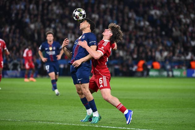 FOOTBALL : PSG vs Liverpool - Ligue des Champions - 08 04 2026 Achraf Hakimi of Paris Saint Germain and Milos Kerkez of Liverpool during the UEFA Champions League match between Paris Saint Germain and Liverpool FC at Parc Des Princes on April 08 , 2026 in Paris, France. ( Photo by Federico Pestellini PsnewZ ) ParisFrance  Copyright: xFedericoxPestellinix