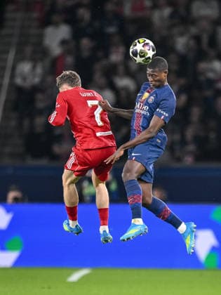 Florian Wirtz (Liverpool FC) and Nuno Mendes (Paris Saint-Germain FC) battle for the ball during the UEFA Champions League 2025 26 Quarter-Final First Leg match between Paris Saint-Germain FC and Liverpool FC at Parc des Princes on April 8, 2026 in Paris, France. (Photo by Harry Langer DeFodi Images) -