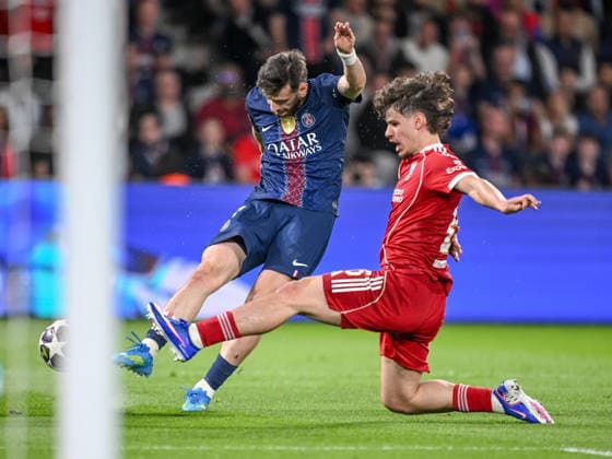 Khvicha Kvaratskhelia (Paris Saint-Germain FC) and Milos Kerkez (Liverpool FC) battle for the ball during the UEFA Champions League 2025 26 Quarter-Final First Leg match between Paris Saint-Germain FC and Liverpool FC at Parc des Princes on April 8, 2026 in Paris, France. (Photo by Harry Langer DeFodi Images) -