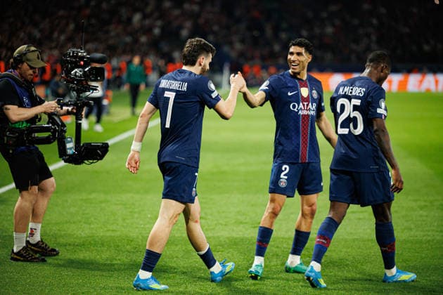 Khvicha Kvaratskhelia and Achraf Hakimi seen celebrating after goal during UEFA Champions League quarterfinal game between teams of Paris Saint-Germain Football Club and Liverpool FC (Maciej Rogowski Ball Raw Images PT) Paris Parc des Princes France Copyright: xMaciejxRogowskix maciejrogowski_psg_liverpool_25_26_2-10