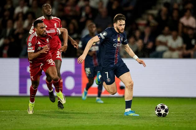 Paris, France - April 8: Khvicha Kvaratskhelia of Paris Saint Germain (R) dribbles against Ryan Gravenberch of Liverpool (L) during the UEFA Champions League 2025 26 Quarter-Final First Leg match between Paris Saint-Germain FC and Liverpool FC at Parc des Princes on April 8, 2026 in Paris, France. (Photo by JustPictures) Paris Parc des Princes France