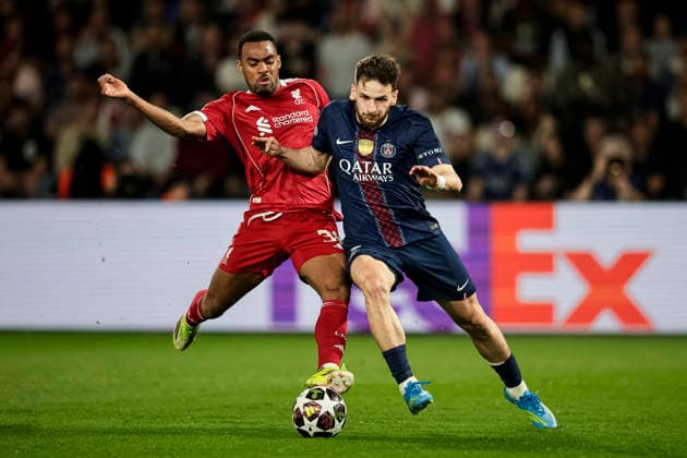 Paris, France - April 8: Khvicha Kvaratskhelia of Paris Saint Germain (R) dribbles against Ryan Gravenberch of Liverpool (L) during the UEFA Champions League 2025 26 Quarter-Final First Leg match between Paris Saint-Germain FC and Liverpool FC at Parc des Princes on April 8, 2026 in Paris, France. (Photo by JustPictures) Paris Parc des Princes France
