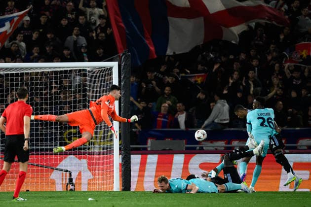 Ezri Konsa of Aston Villa FC (r) past Federico Ravaglia of Bologna FC and scores the goal of 0-1 during the UEFA Europa League 2025 2026 football match between Bologna FC 1909 and Aston Villa FC at Renato Dall Ara Stadium in Bologna (Italy), April 9, 2026. andreaxstaccioli