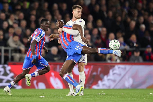9th April 2026; Selhurst Park, Selhurst, London, England; Europa Conference League Football, Crystal Palace versus Fiorentina; Jean-Philippe Mateta of Crystal Palace feels pressure from Marin Pongracic of Fiorentina HenningxvonxJagow