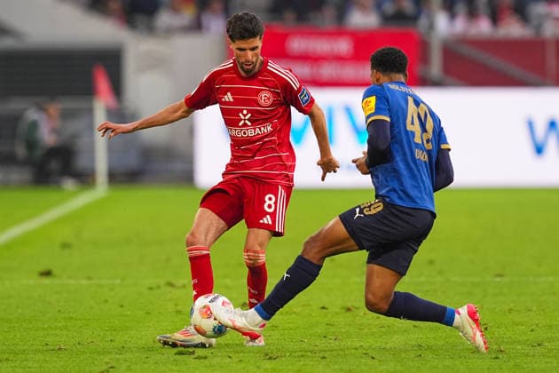 10.04.2026, xydrx, Fußball, 2. Fußball Bundesliga, Fortuna Düsseldorf - Holstein Kiel, Saison 2025 2026, Merkur Spiel-Arena: Anouar El Azzouzi (Fortuna Düsseldorf, 8) im Zweikampf gegen Ikem Arinzechukwu Ugoh (Holstein Kiel, 49) DFB regulations prohibit any use of photographs as image sequences and or quasi-video. *** 10 04 2026, xydrx, Fußball, 2 Fußball Bundesliga, Fortuna Düsseldorf Holstein Kiel, Saison 2025 2026, Merkur Spiel Arena Anouar El Azzouzi Fortuna Düsseldorf, 8 im Zweikampf gegen Ikem Arinzechukwu Ugoh Holstein Kiel, 49 DFB regulations prohibit any use of photographs as image sequences and or quasi video Copyright: HMBxMedia YannisxDreimann