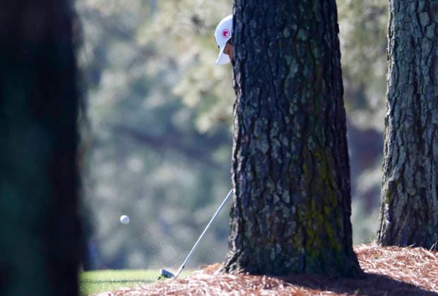 Tyrrell Hatton of England hits out of the pine straw on the first fairway during the second day of the Masters Tournament at Augusta National Golf Club on Friday, April 10, 2026, in Augusta, Georgia.  AUG20260410804 JOHNxANGELILLO