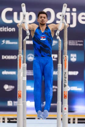 DOBRO FIG Apparatus World Cup Osijek 2026 Qualifications Petar Vefic of Serbia performs on the parallel bars during the DOBRO FIG Apparatus World Cup Osijek 2026 Qualifications at Sports Hall Gradski vrt on April 10, 2026. in Osijek, Croatia.  DavorxJavorovic PIXSELL