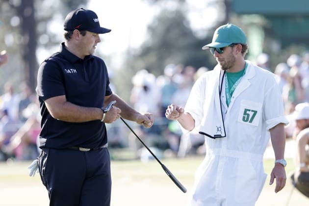 Golf 2026 Masters Tournament - Round 2 Patrick Reed of USA (L) fist bumps his caddie Kessler Karain walk after making a birdie on the 17th hole during Round 2 of the 2026 Masters tournament in August, Georgia, USA, 10 April 2026. Augusta United States  Copyright: xERIKxS.xLESSERx