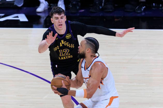 April 10, 2026, Los Angeles, California, USA: Dillon Brooks 3 of the Phoenix Suns makes a three point shot attempt as Jake LaRavia 12 of the Los Angeles Lakers defends during their regular season NBA, Basketball Herren, USA game on Friday April 10, 2026 at Crypto.com Arena in Los Angeles, California. Lakers defeat Suns, 101-73. ARIANA RUIZ PI Lakers Defeat Suns, 101-73  - ZUMAp124 20260410_zaa_p124_026 Copyright: xArianaxRuizx