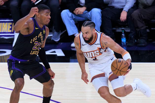 April 10, 2026, Los Angeles, California, USA: Dillon Brooks 3 of the Phoenix Suns drives as Rui Hachimura 28 of the Los Angeles Lakers defends during their regular season NBA, Basketball Herren, USA game on Friday April 10, 2026 at Crypto.com Arena in Los Angeles, California. Lakers defeat Suns, 101-73. ARIANA RUIZ PI Los Angeles USA - ZUMAp124 20260410_zaa_p124_020 Copyright: xArianaxRuizx