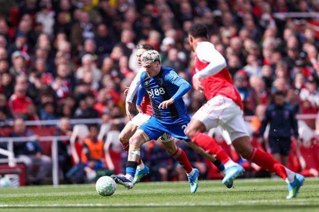 11th April 2026; Emirates Stadium, London, England; Premier League Football, Arsenal versus Bournemouth; Alex Jimenez of Bournemouth running with the ball under pressure from Leandro Trossard of Arsenal KatiexChan
