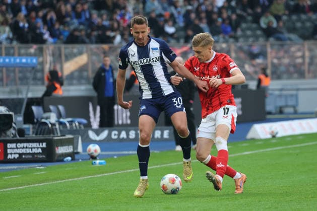 BERLIN, DEUTSCHLAND - APRIL 11: Paul Seguin (Hertha, 30) in the duel for the ball with Norman Bassette (Kaiserslautern, 17), during the match in the 2. German Bundesliga: Hertha BSC - 1. FC Kaiserslautern at Olympiastadion on matchday 29 on April 11, 2026 in Berlin, Deutschland. DFB regulations prohibit any use of photographs as image sequences and or quasi video. Berlin Deutschland Copyright: xO.Frankex