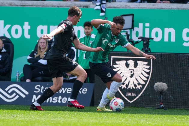 Deutschland: Fussball 2. Bundesliga, Saison 2025 26, 29. Spieltag, Preußen Münster vs SpVgg Greuther Fürth, 11.04.2026, LVM Preußenstadion (Münster, Nordrhein-Westfalen) Yassine Bouchama (Preußen Münster, 5) Lukas Reich (SpVgg Greuther Fürth, 2)