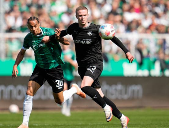 April 11, 2026, Muenster, Germany: SC Preussen Muenster forward ETIENNE AMENYIDO (30) against SpVgg Greuther Fuerth midfielder BRYNJAR INGI BJARNASON (25) during the match between SC Pruessen Muenster and SpVgg Greuther Fuerth in the 2. Bundesliga on April 11, 2026, in Muenster, Germany...DFL REGULATIONS PROHIBIT ANY USE OF PHOTOGRAPHS AS IMAGE SEQUENCES AND OR QUASI-VIDEO Soccer 2026: Pruessen Muenster 0:0 SpVgg Greuther Fuerth  - ZUMAc201 20260411_zap_c201_011 Copyright: xScottxColemanx