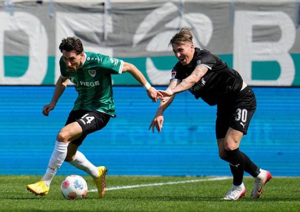 April 11, 2026, Muenster, Germany: SpVgg Greuther Fuerth midfielder FELIX KLAUS (30) pushes SC Preussen Muenster midfielder HARALAMBOS MAKRIDIS (14) during the match between SC Pruessen Muenster and SpVgg Greuther Fuerth in the 2. Bundesliga on April 11, 2026, in Muenster, Germany...DFL REGULATIONS PROHIBIT ANY USE OF PHOTOGRAPHS AS IMAGE SEQUENCES AND OR QUASI-VIDEO Soccer 2026: Pruessen Muenster 0:0 SpVgg Greuther Fuerth  - ZUMAc201 20260411_zap_c201_035 Copyright: xScottxColemanx