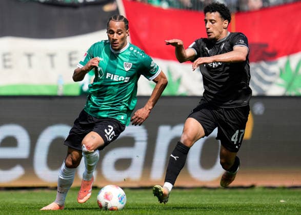 April 11, 2026, Muenster, Germany: SC Preussen Muenster forward ETIENNE AMENYIDO (30) works against SpVgg Greuther Fuerth forward SAYFALLAH LTAIEF (47) during the match between SC Pruessen Muenster and SpVgg Greuther Fuerth in the 2. Bundesliga on April 11, 2026, in Muenster, Germany...DFL REGULATIONS PROHIBIT ANY USE OF PHOTOGRAPHS AS IMAGE SEQUENCES AND OR QUASI-VIDEO Soccer 2026: Pruessen Muenster 0:0 SpVgg Greuther Fuerth  - ZUMAc201 20260411_zap_c201_033 Copyright: xScottxColemanx