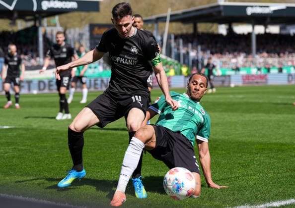 April 11, 2026, Muenster, Germany: SpVgg Greuther Fuerth forward BRANIMIR HRGOTA (10) against SC Preussen Muenster forward ETIENNE AMENYIDO (30) during the match between SC Pruessen Muenster and SpVgg Greuther Fuerth in the 2. Bundesliga on April 11, 2026, in Muenster, Germany...DFL REGULATIONS PROHIBIT ANY USE OF PHOTOGRAPHS AS IMAGE SEQUENCES AND OR QUASI-VIDEO Muenster Germany - ZUMAc201 20260411_zap_c201_064 Copyright: xScottxColemanx