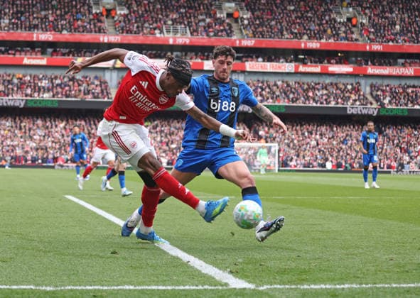 Noni Madueke (A) Marcos Senesi (AFC B) at the Arsenal v AFC Bournemouth EPL match, at the Emirates Stadium, London, UK on 11th April, 2026. 