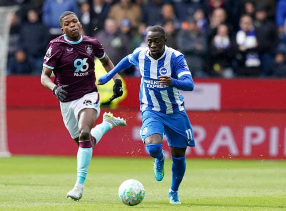 Burnley, England, 11th April 2026. Yankuba Minteh of Brighton (R) is challenged by Florentino Luis of Burnley during the Burnley vs Brighton and Hove Albion Premier League match at Turf Moor, Burnley. Picture credit should read: Andrew Yates Sportimage EDITORIAL USE ONLY. No use with unauthorised audio, video, data, fixture lists, club league logos or live services. Online in-match use limited to 120 images, no video emulation. No use in betting, games or single club league player publications. SPI_025_AY_BURNLEY_BRIGHTON SPI-4677-0027