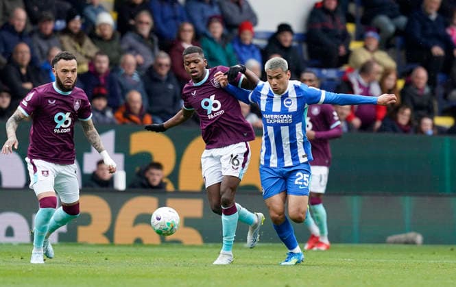 Burnley, England, 11th April 2026. Diego Gomez of Brighton (R) is challenged by Florentino Luis of Burnley during the Burnley vs Brighton and Hove Albion Premier League match at Turf Moor, Burnley. Picture credit should read: Andrew Yates Sportimage EDITORIAL USE ONLY. No use with unauthorised audio, video, data, fixture lists, club league logos or live services. Online in-match use limited to 120 images, no video emulation. No use in betting, games or single club league player publications. SPI_028_AY_BURNLEY_BRIGHTON SPI-4677-0028