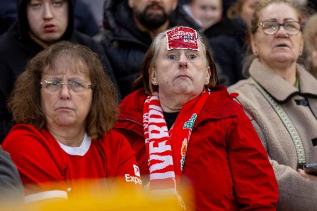 Football - FA Premier League - Liverpool FC v Fulham FC LIVERPOOL, ENGLAND - Saturday, April 11, 2026: A Liverpool supporter with a sticker We are Liverpool, this costs more in relation to a fan protest about rising ticket prices during the FA Premier League match between Liverpool FC and Fulham FC at Anfield. (Photo by David Rawcliffe Propaganda) LIVERPOOL Anfield MERSEYSIDE ENGLAND  Copyright: xDavidxRawcliffex P2026-04-11-Liverpool_Fulham-85