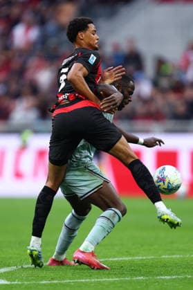 Koni De Winter (Ac Milan) und Keinan Davis (Udinese Calcio) battle for the ball, Serie A, AC Milan v Udinese Calcio, Giuseppe Meazza, April 11, 2026, Milan, Italy.
