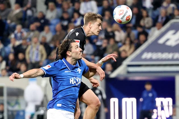 11.04.2026, xtvx, Fussball 2.Bundesliga, SV Darmstadt 98 - Hannover 96 v.l. Zweikampf, Duell, duel, tackle, compete Fraser Hornby (SV Darmstadt 98) Maik Nawrocki (Hannover 96) (DFL DFB REGULATIONS PROHIBIT ANY USE OF PHOTOGRAPHS as IMAGE SEQUENCES and or QUASI-VIDEO) Darmstadt