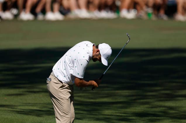 Scottie Scheffler reacts after his pitch shot to the 15th green during the third round of the Masters Tournament at Augusta National Golf Club on Saturday, April 11, 2026, in Augusta, Georgia.  AUG20260411815 JOHNxANGELILLO