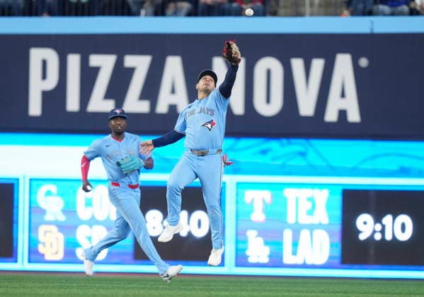 April 11, 2026, Toronto, On, CANADA: Toronto Blue Jays outfielder Daulton Varsho (5) misses a ball as teammate Jesus Sanchez (12) looks on during third inning American League MLB, Baseball Herren, USA baseball action against Minnesota Twins in Toronto on Saturday, April 11, 2026. Canada News - April 11, 2026  - ZUMAc35_ 20260411_zaf_c35_082 Copyright: xNathanxDenettex
