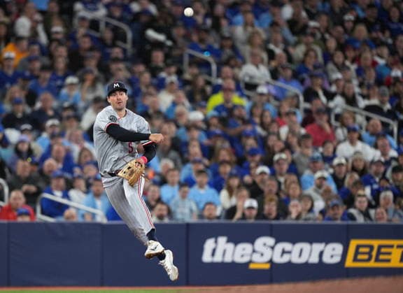 April 11, 2026, Toronto, On, CANADA: Minnesota Twins third baseman Ryan Kreidler (5) makes a leaping throw to out Toronto Blue Jays designated hitter George Springer at first base during third inning American League MLB, Baseball Herren, USA baseball action in Toronto on Saturday, April 11, 2026. Canada News - April 11, 2026  - ZUMAc35_ 20260411_zaf_c35_087 Copyright: xNathanxDenettex