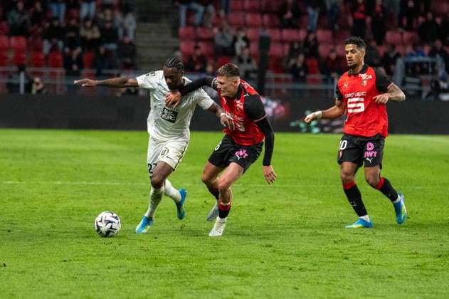 FOOTBALL : Stade Rennais vs Angers SCO - Ligue 1 - JournÃ e 29 - 11 04 2026 Lilian Raolisoa (Angers SCO), Quentin Merlin (Stade Rennais FC), Ludovic Blas (Stade Rennais FC) RennesFrance  Copyright: xEmilienxJousselinx