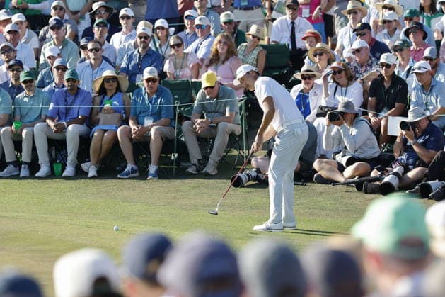 Golf 2026 Masters Tournament - Round 3 Haotong Li of China putts on the 18th green in Round 3 of the 2026 Masters tournament in Augusta, Georgia, USA, 11 April 2026. Augusta United States  Copyright: xERIKxS.xLESSERx