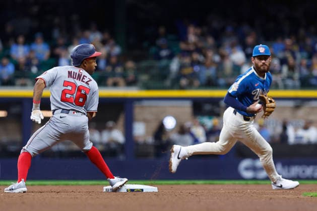 MILWAUKEE, WI - APRIL 11: Washington Nationals shortstop Nasim Nunez (26) looks back to see if Milwaukee Brewers shortstop Joey Ortiz (3) has the ball during a game between the Milwaukee Brewers and the Washington Nationals at American Family Field on April 11, 2026, in Milwaukee, WI. (Photo by Larry Radloff Icon Sportswire) MLB, Baseball Herren, USA APR 11 Nationals at Brewers EDITORIAL USE ONLY Icon2604111588