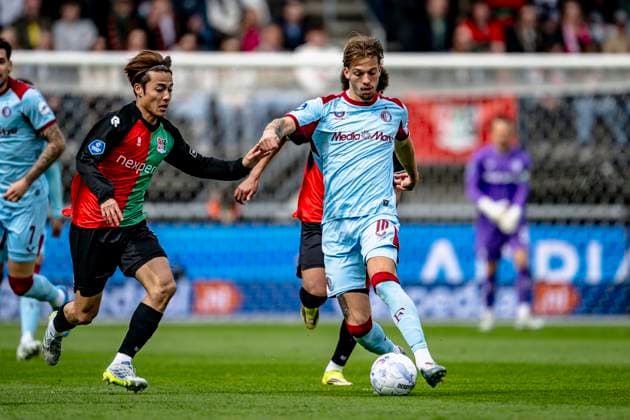 NIJMEGEN - (lr) NEC player Kodai Sano, Feyenoord Rotterdam midfielder Luciano Valente during the Dutch Vriendenloterij Eredivisie match between NEC and Feyenoord at De Goffert stadium on April 12, 2026 in Nijmegen, the Netherlands. (Photo by Stefan Koops EYE4IMAGES DeFodi Images) -