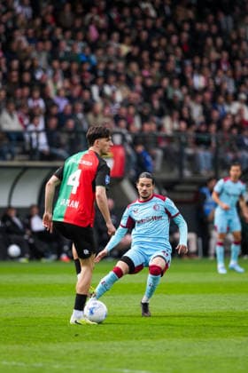 Eredivisie: NEC Nijmegen v Feyenoord Rotterdam Nijmegen - Ahmetcan Kaplan of NEC Nijmegen, Anis Hadj Moussa of Feyenoord during the thirtieth competition round of the 2025 2026 Eredivisie season. The match is set between NEC Nijmegen and Feyenoord Rotterdam at Goffertstadion on 12 April 2026 in Nijmegen, The Netherlands. Copyright: xTomxBodex