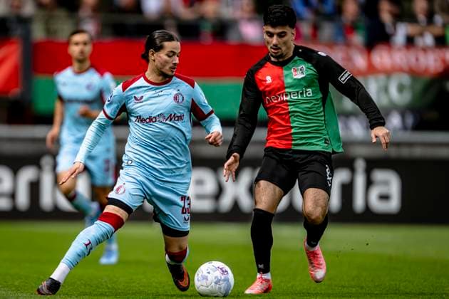 NIJMEGEN - (lr) Feyenoord Rotterdam forward Anis Hadj Moussa, NEC player Basar Onal during the Dutch Vriendenloterij Eredivisie match between NEC and Feyenoord at De Goffert stadium on April 12, 2026 in Nijmegen, the Netherlands. (Photo by Stefan Koops EYE4IMAGES DeFodi Images) -