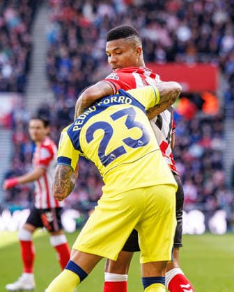 12th April 2026; Stadium of Light, Sunderland, England; Premier League Football, Sunderland versus Tottenham Hotspur; Pedro Porro battles with Reinildo Mandava of Sunderland WMxSportsxMedia