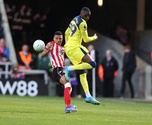 Sunderland, England, 12th April 2026. Randal Kolo Muani (R) Tottenham Hotspur in action with Reinildo Mandava of Sunderland during the Sunderland vs Tottenham Hotspur Premier League match at the Stadium Of Light, Sunderland. Picture credit should read: Nigel Roddis Sportimage EDITORIAL USE ONLY. No use with unauthorised audio, video, data, fixture lists, club league logos or live services. Online in-match use limited to 120 images, no video emulation. No use in betting, games or single club league player publications. SPI_024_NR_SUND_TOTT SPI-4681-0025