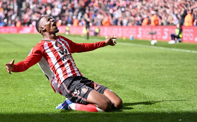 Nordi Mukiele of Sunderland scores the opening goal with a massive deflection off Cristian Romero of Tottenham Hotspur and celebrates Sunderland v Tottenham Hotspur, Premier League, Football, Stadium of Light, Sunderland, UK - 12 Apr 2026Sunderland Stadium of Light United Kingdom EDITORIAL USE ONLY No use with unauthorised audio, video, data, fixture lists, club league logos or live services. Online in-match use limited to 120 images, no video emulation. No use in betting, games or single club league player publications. Copyright: xGreigxCowie Shutterstockx 16823609u