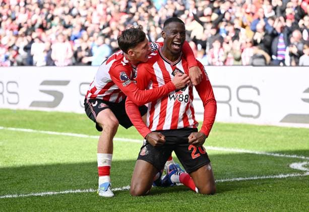 Nordi Mukiele of Sunderland scores the opening goal with a massive deflection off Cristian Romero of Tottenham Hotspur and celebrates Sunderland v Tottenham Hotspur, Premier League, Football, Stadium of Light, Sunderland, UK - 12 Apr 2026Sunderland Stadium of Light United Kingdom EDITORIAL USE ONLY No use with unauthorised audio, video, data, fixture lists, club league logos or live services. Online in-match use limited to 120 images, no video emulation. No use in betting, games or single club league player publications. Copyright: xGreigxCowie Shutterstockx 16823609x