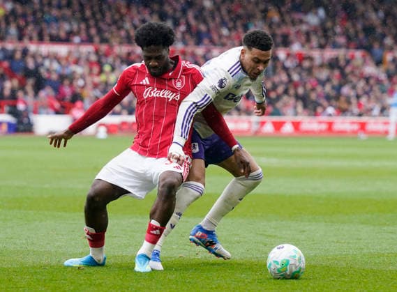 Nottingham, England, 12th April 2026. Morato of Nottingham Forest (l) tackles Morgan Rogers of Aston Villa (r) during the Nottingham Forest vs Aston Villa Premier League match at the City Ground, Nottingham. Picture credit should read: Andrew Yates Sportimage EDITORIAL USE ONLY. No use with unauthorised audio, video, data, fixture lists, club league logos or live services. Online in-match use limited to 120 images, no video emulation. No use in betting, games or single club league player publications. SPI_045_AY_Forest_Villa SPI-4682-0045