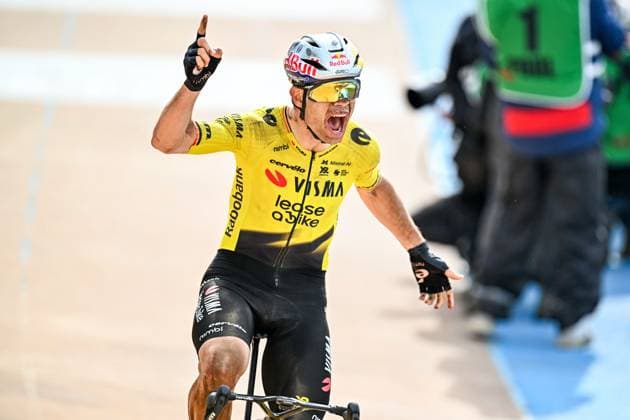 Belgian Wout van Aert of Team Visma-Lease a Bike celebrates as he crosses the finish line to win the men s Paris-Roubaix cycling race, Sunday 12 April 2026, around Roubaix, France. The 123rd edition of Paris-Roubaix cycling races will take on Sunday, with the women riding 143,1 km the men riding 258,3 km on Sunday. JASPERxJACOBS  x170567062x