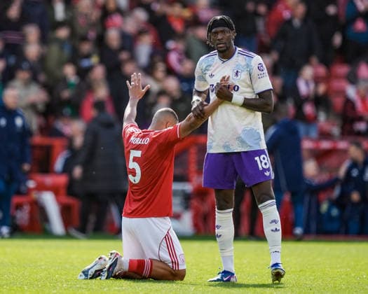 Premier League: Nottingham Forest v Aston Villa Tammy Abraham of Aston Villa prays for Murillo of Nottingham Forest at full time during the Premier League match Nottingham Forest vs Aston Villa at City Ground, Nottingham, United Kingdom on 12 April 2026 (Photo by Maynard Manyowa News Images) Nottingham City Ground Nottinghamshire United Kingdom Copyright: xMaynardxManyowa NewsxImagesx