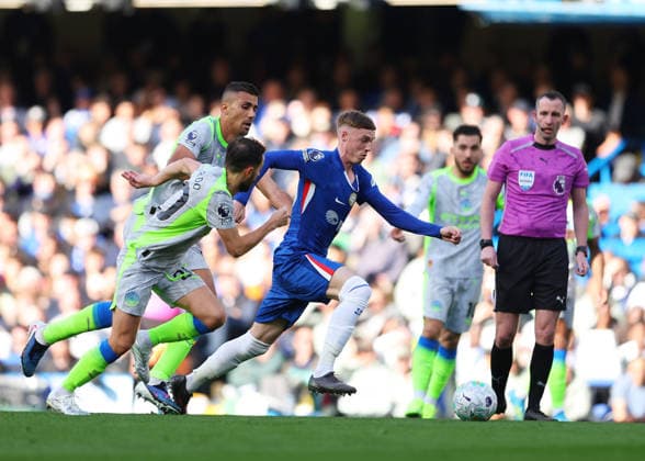 12th April 2026; Stamford Bridge, Chelsea, London, England: Premier League Football, Chelsea versus Manchester City; Cole Palmer of Chelsea under pressure from Bernardo Silva and Rodri of Manchester City JPxFletcher