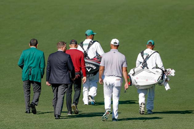 Golf - Masters Tournament round 4 A rules and club official speak with Sergio Garcia (L) and Jon Rahm of Spain as they walk down the fairway on the fourth hole during the final round of the 2026 Masters Tournament at the Augusta National Golf Club in Augusta, Georgia, USA, 12 April 2026. AUGUSTA GEORGIA United States  Copyright: xERIKxS.xLESSERx
